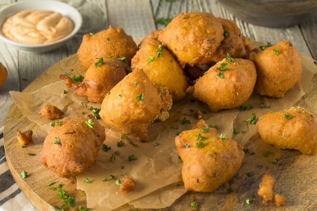Golden-brown Hush Puppies, a Southern comfort food favorite, presented in all their delicious glory